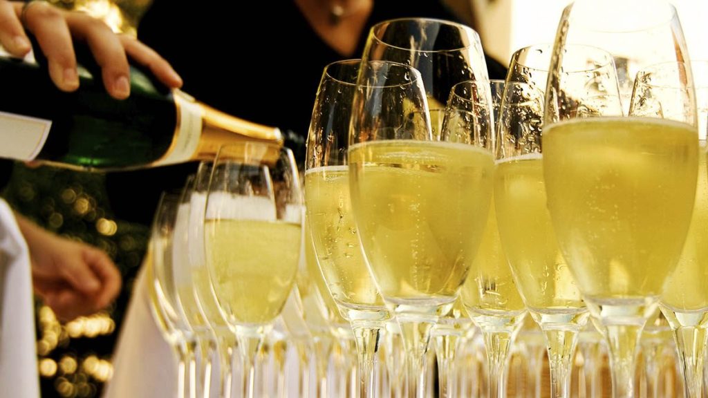pouring champagne into glasses